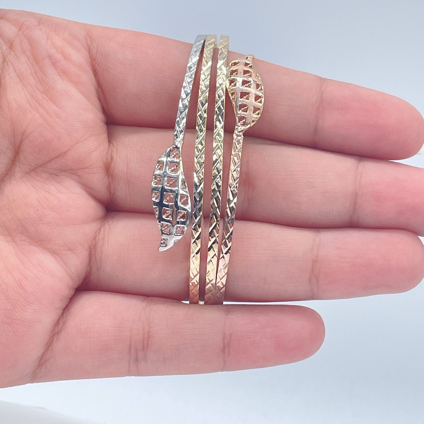 18k Gold Layered Tri-Color Cuff Bracelet Featuring Texture Leaves On Two Ends,