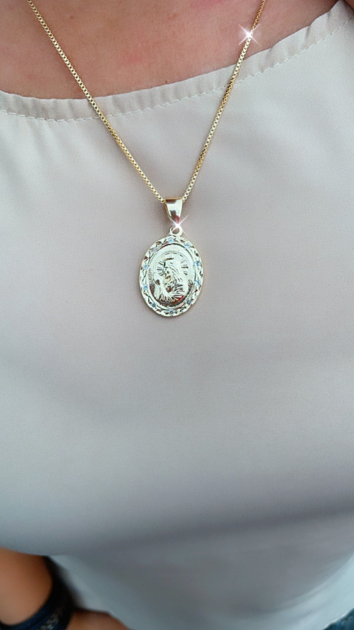 Double sided 18k Gold Filled Jesus Charm And Cross In The Back Featuring Cubic Zirconia Around Pendant