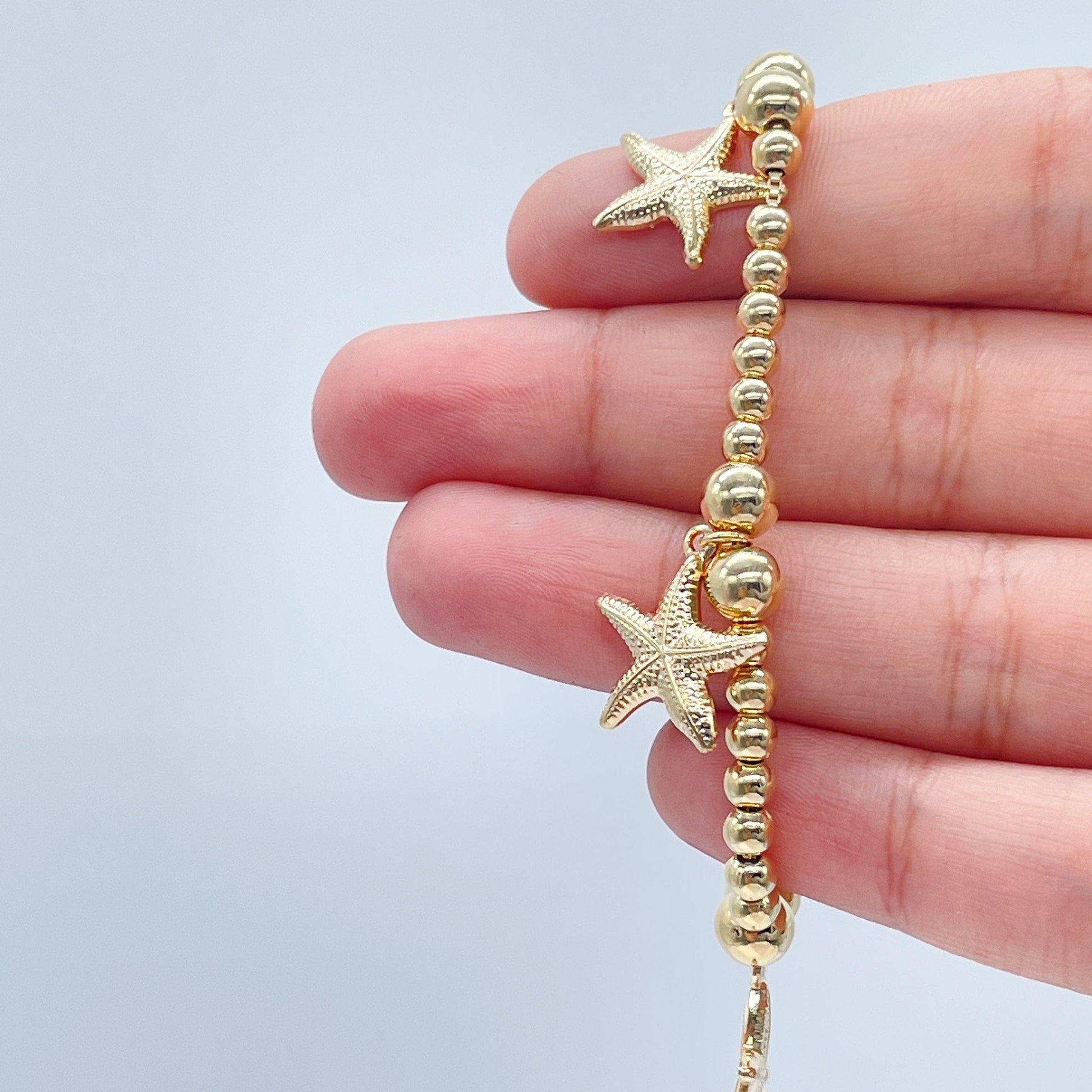 18k Gold Filled 4mm Beaded Bracelet With Starfish Charms In An Sophisticated