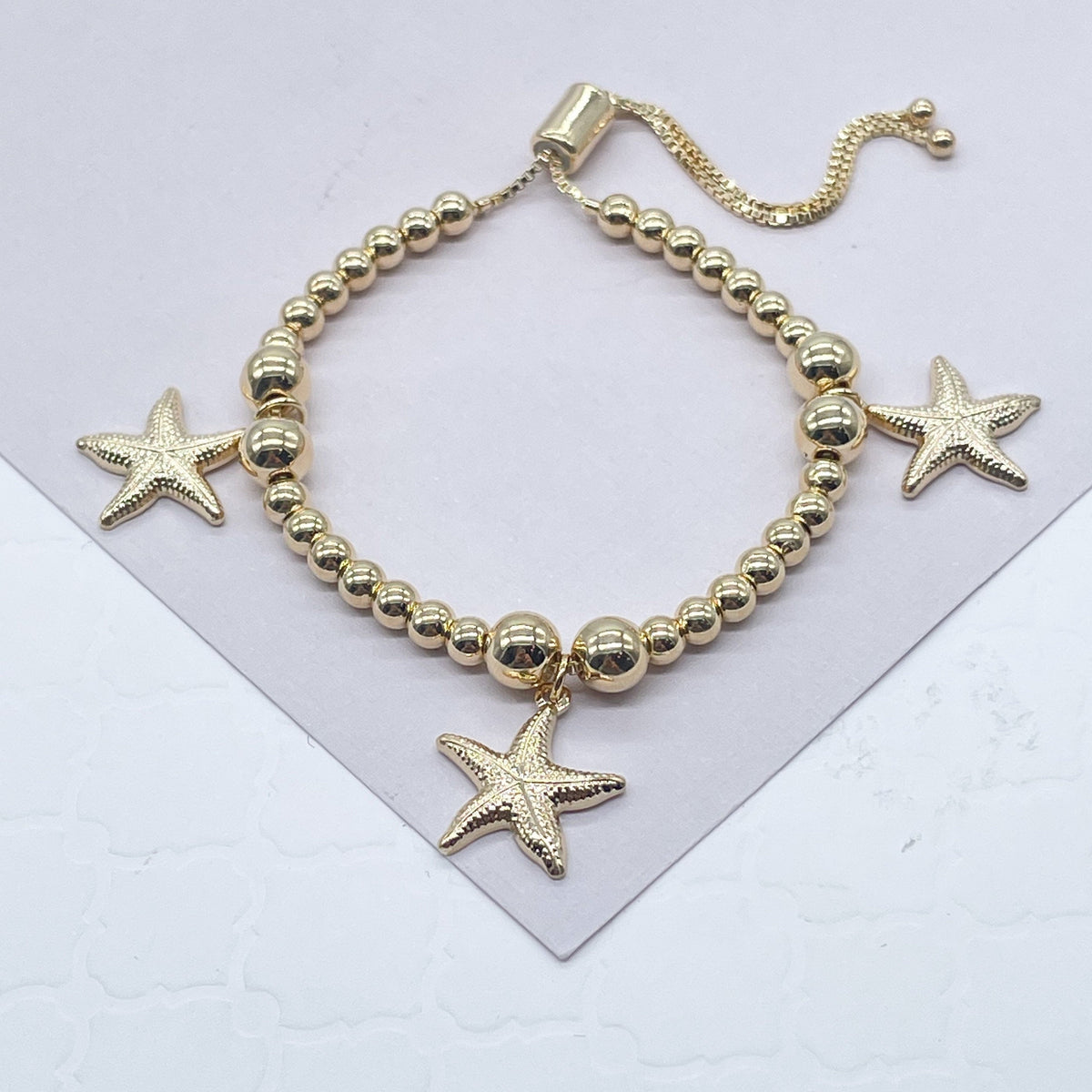 18k Gold Filled 4mm Beaded Bracelet With Starfish Charms In An Sophisticated Slide Clasp Jewelry