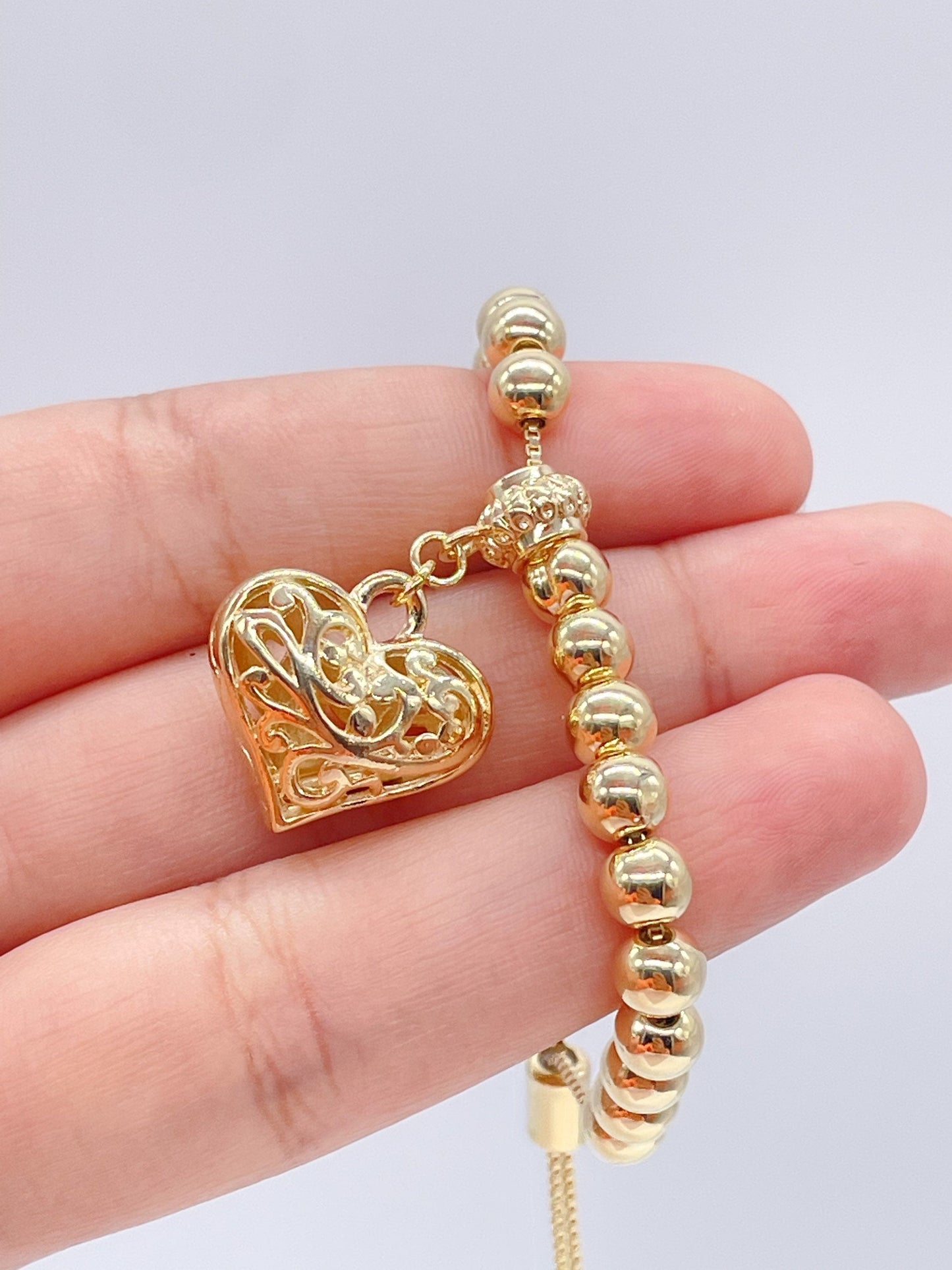 18k Gold Filled Beaded Bracelet With Patterned See Through Heart Featuring Fancy Bail And Slide Clasp