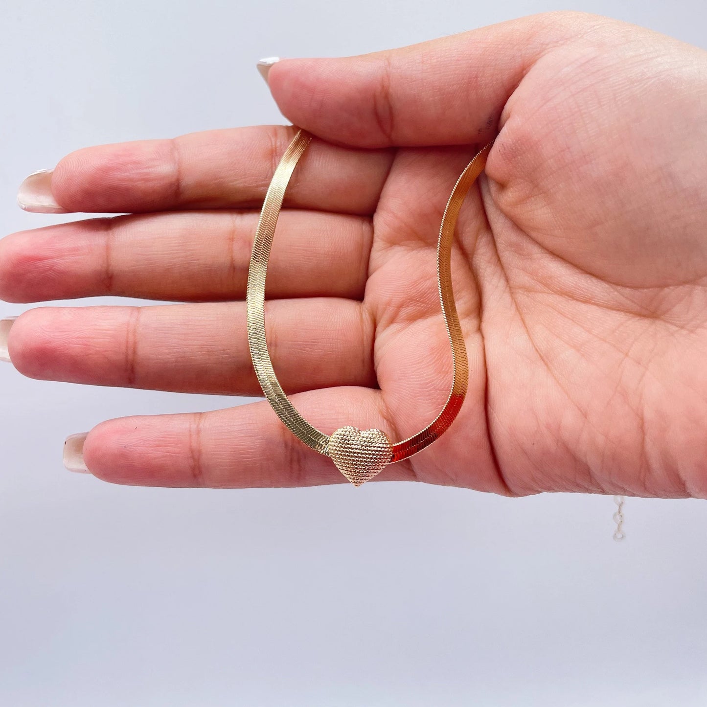 18k Gold Filled 3mm Herringbone Set featuring a small textured heart in the middle