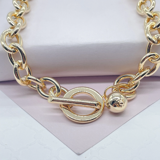 18k Gold Layered Oval Link Necklace And Bracelet Set Featuring Toggle Closure And Hanging Ball