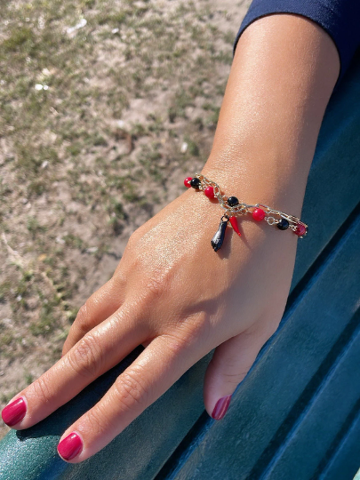 18k Gold Layered Bracelet with black and red beads and Pepper & Figa Charms