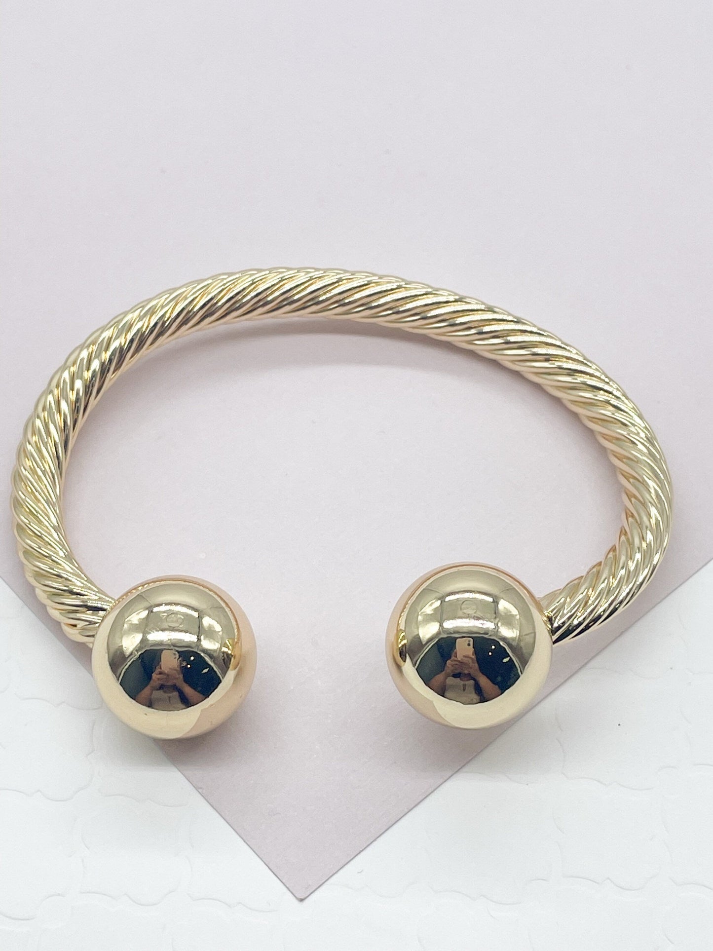 18k Gold Layered Twisted Bangle Featuring Two Solid Balls On Top Wholesale
