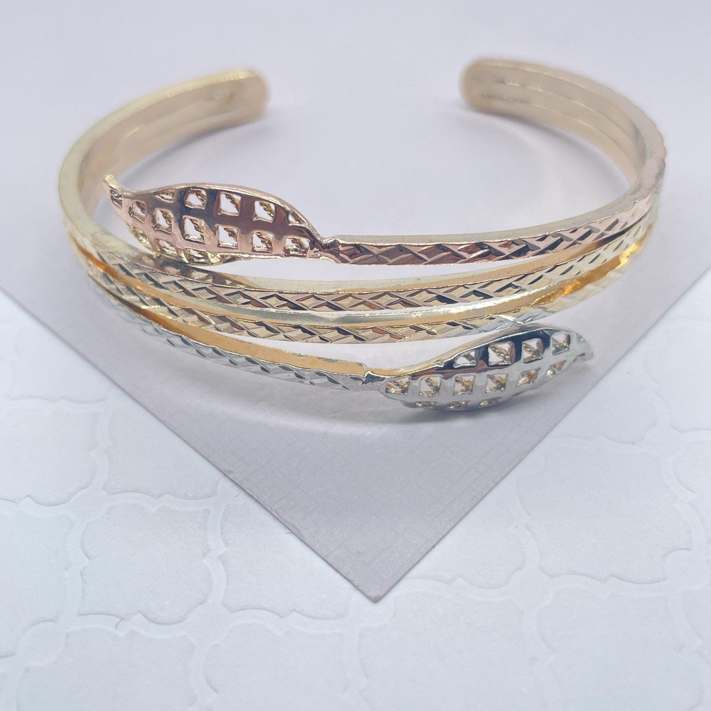 18k Gold Layered Tri-Color Cuff Bracelet Featuring Texture Leaves On Two Ends,
