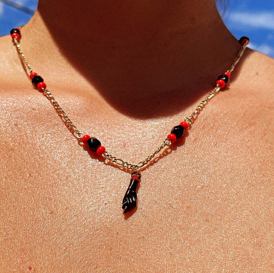 18k Gold Layered Figaro Necklace Featuring Black "Figa", Red Beads, Simulated