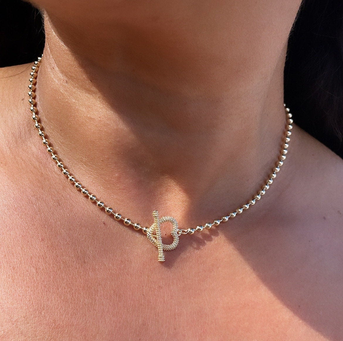 18k Gold Layered 3mm Beaded Necklace Featuring Toggle Heart Clasp