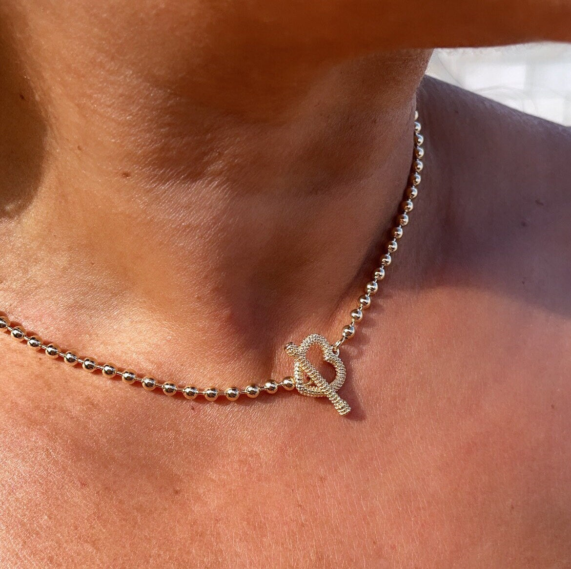 18k Gold Layered 3mm Beaded Necklace Featuring Toggle Heart Clasp