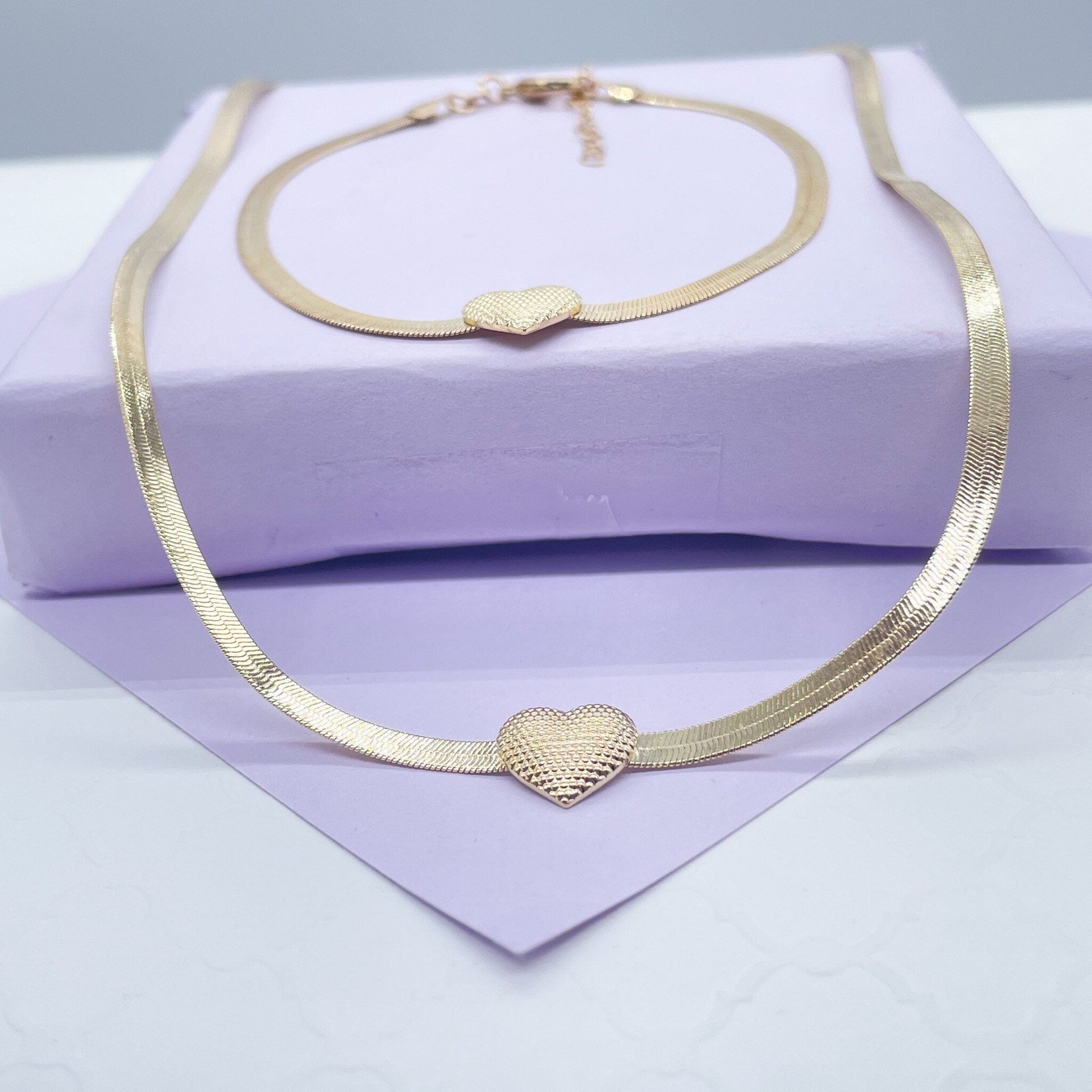 18k Gold Filled 3mm Herringbone Set featuring a small textured heart in the middle